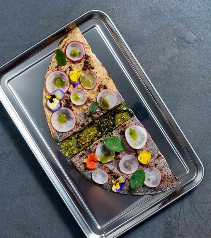 Wood-fire quesadilla layered with Alpenkäse, Tatemada sauce and wild garlic oil Wood-fire quesadilla layered with Alpenkäse, Tatemada sauce and wild garlic oil